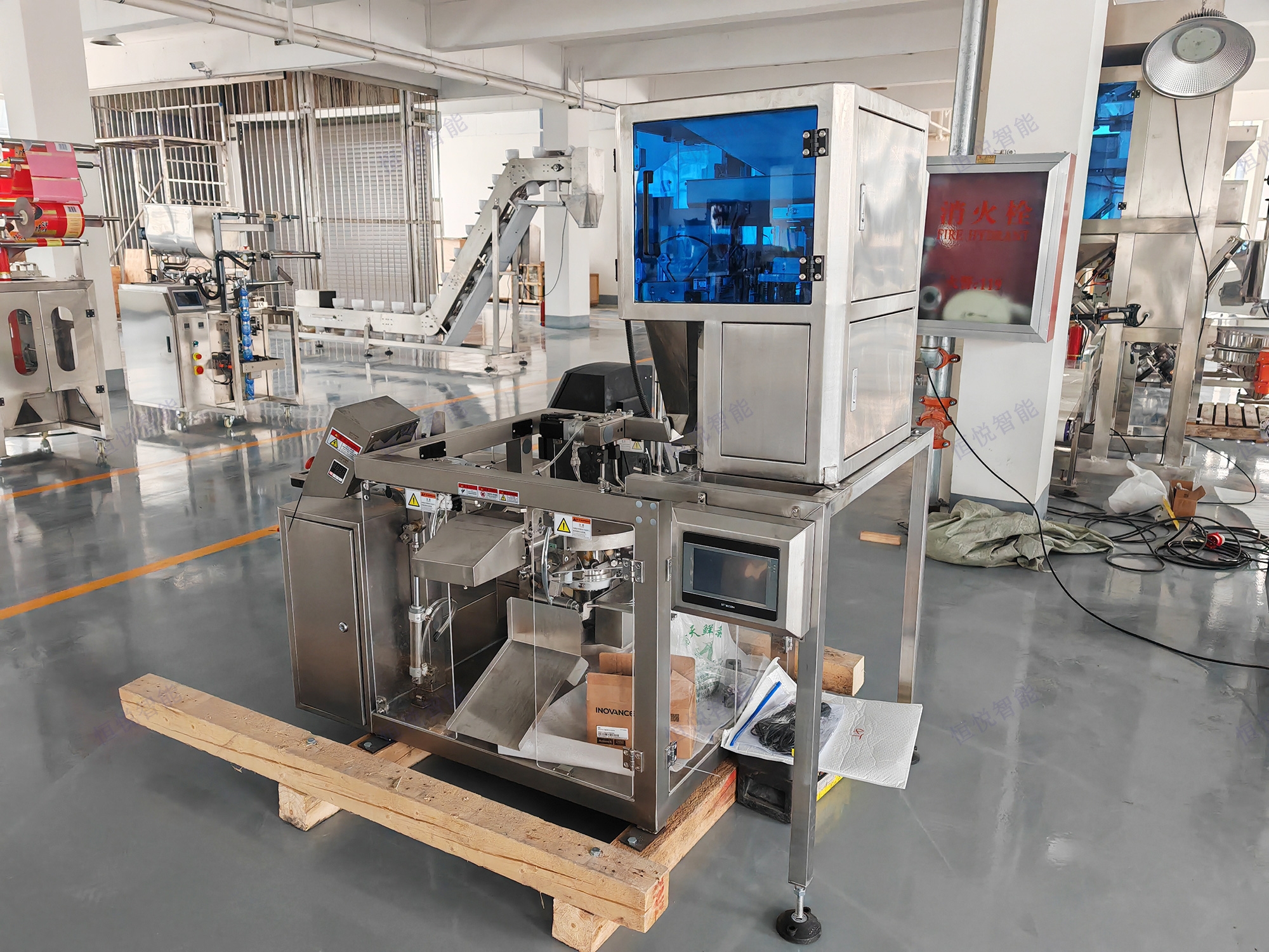 小型六工位給袋式自動包裝機工作流程